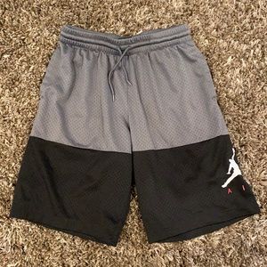 Grey and black Jordan shorts.